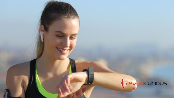 earbuds checking smart watch