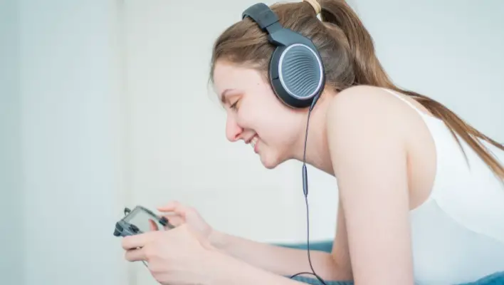 Girl enjoying music using Sennheiser headphone